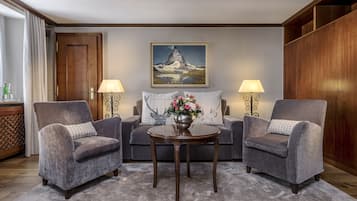 Edelweiss Deluxe Room, Mountain View | Living area | Plasma TV