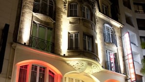 A multi-story building with a ground-floor retail space and upper residential or office units. - Hotel Cecyl Reims Centre (Reims)