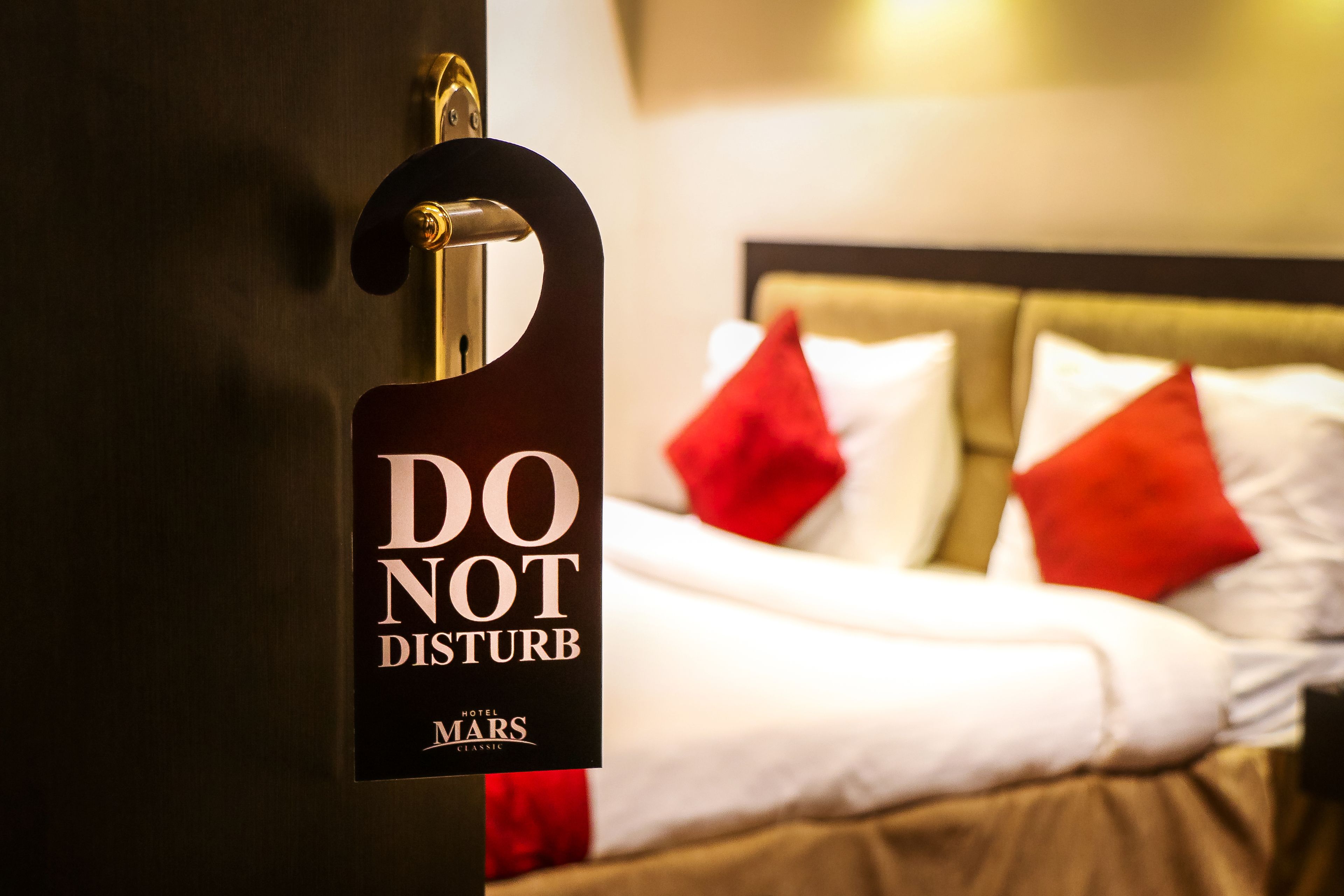 A hotel sign with "DO NOT DISTURB" and "MARS" indicating a quiet room.