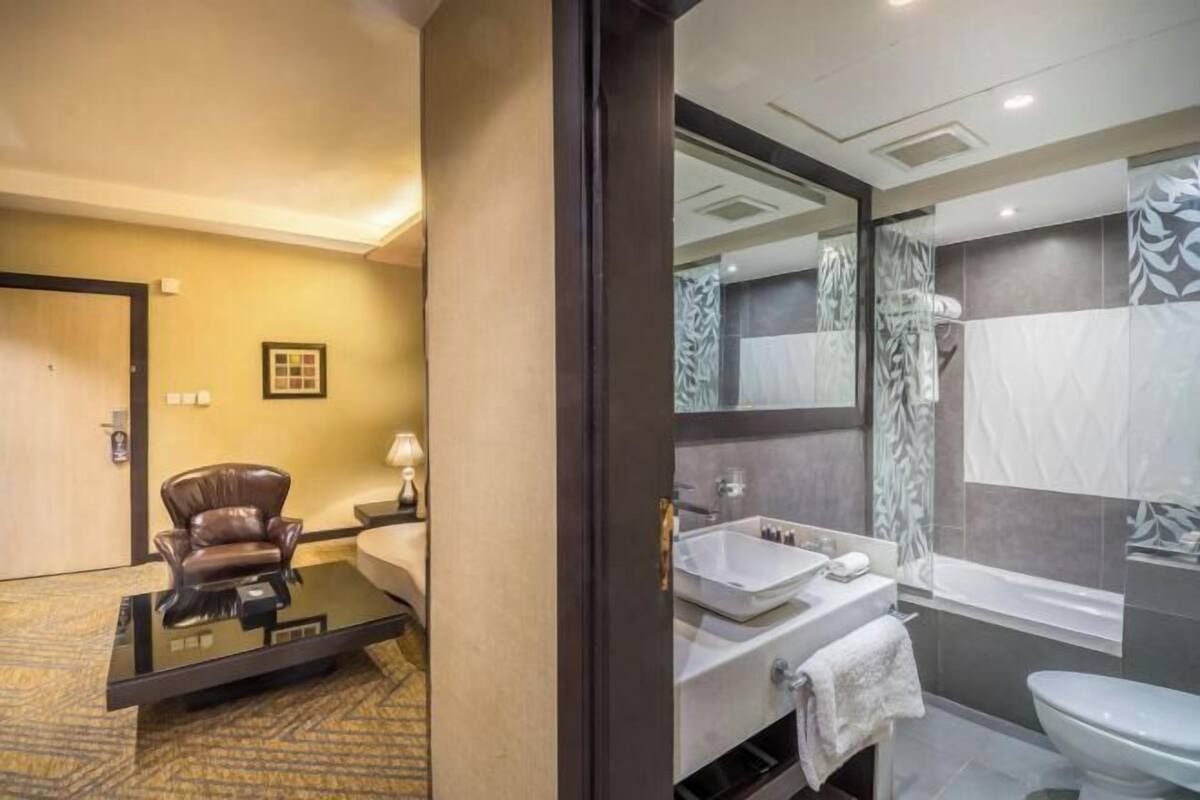 Bathroom | Deep soaking tub, free toiletries, slippers, towels