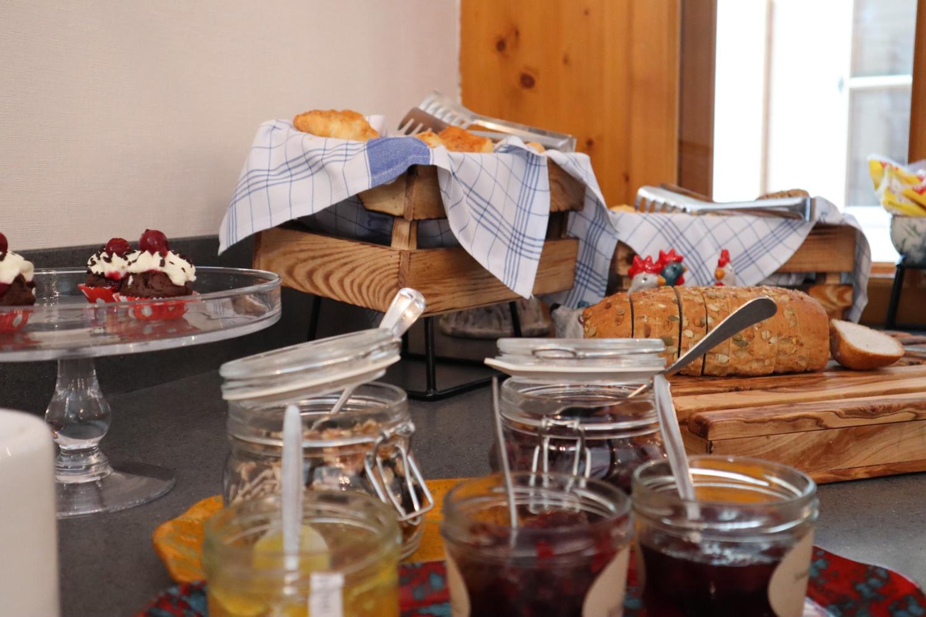 A breakfast buffet with various food items and condiments.