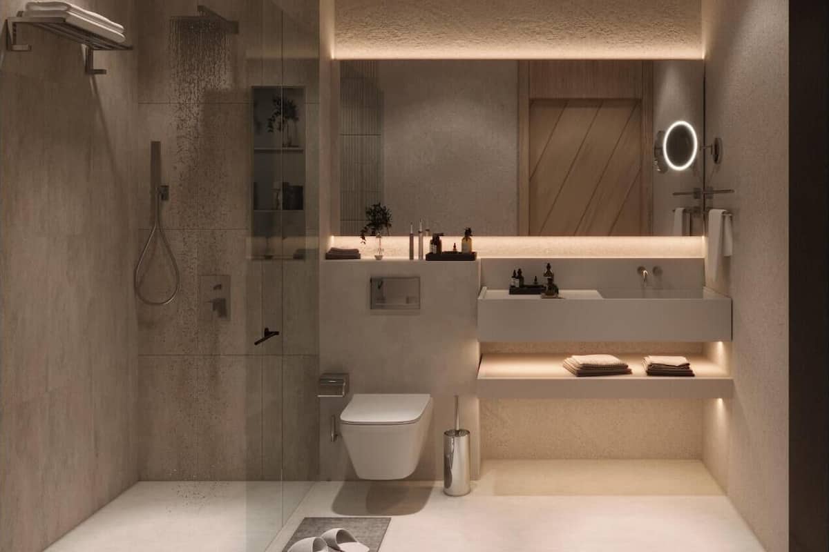A modern bathroom with a glass-enclosed shower, a toilet, a sink with a mirror, and a towel rack.