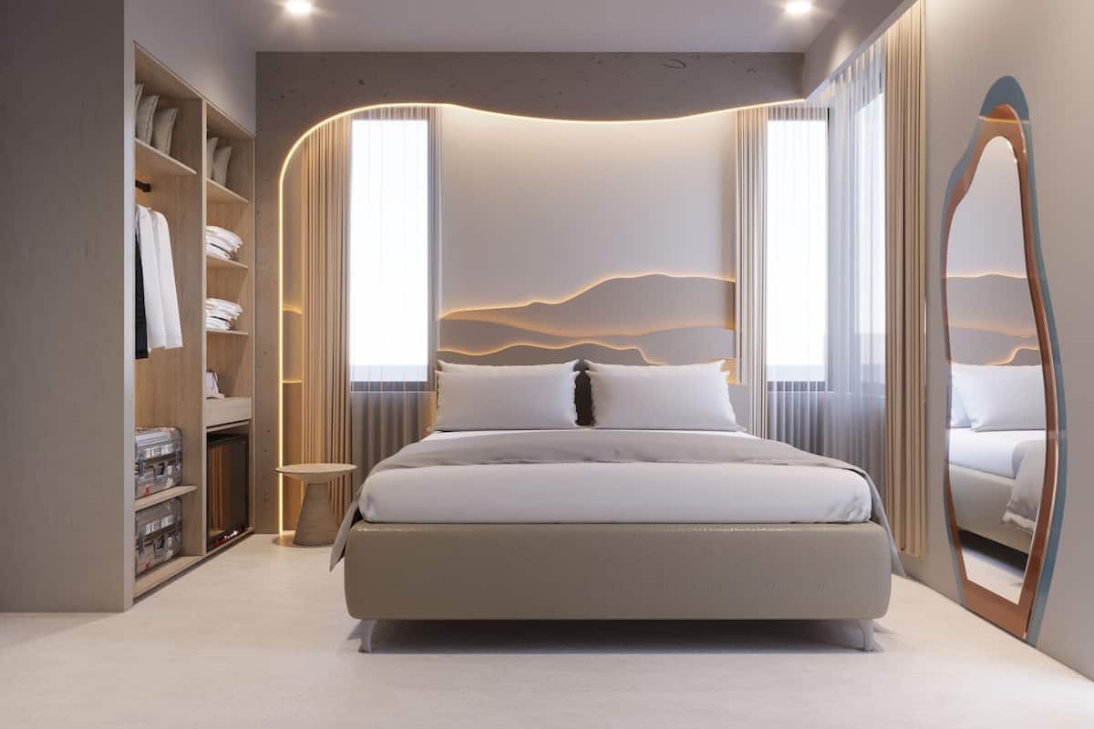 A modern bedroom with a large bed, built-in wardrobe, and a unique wall design.