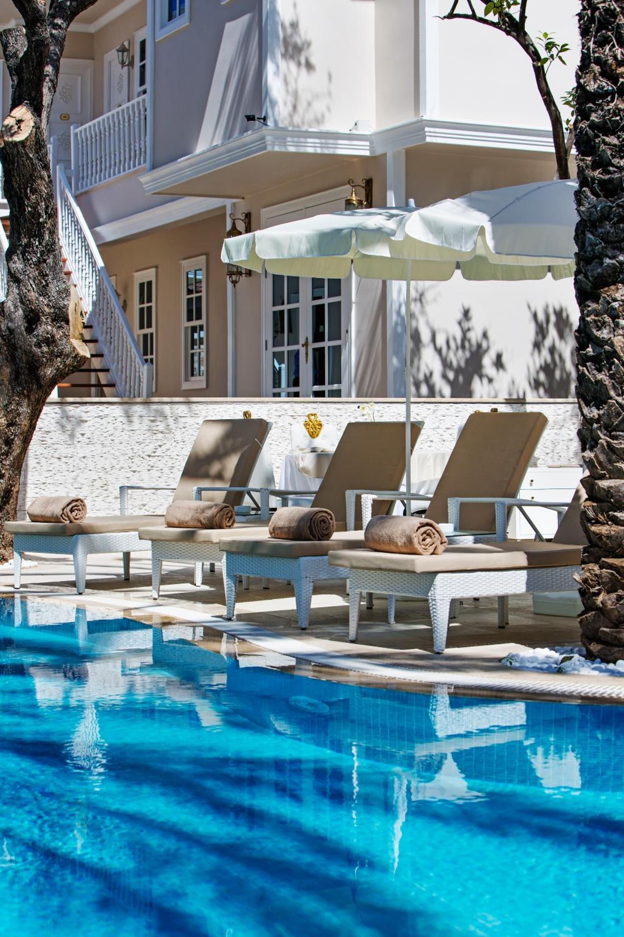 outdoor pool, pool umbrellas, pool loungers