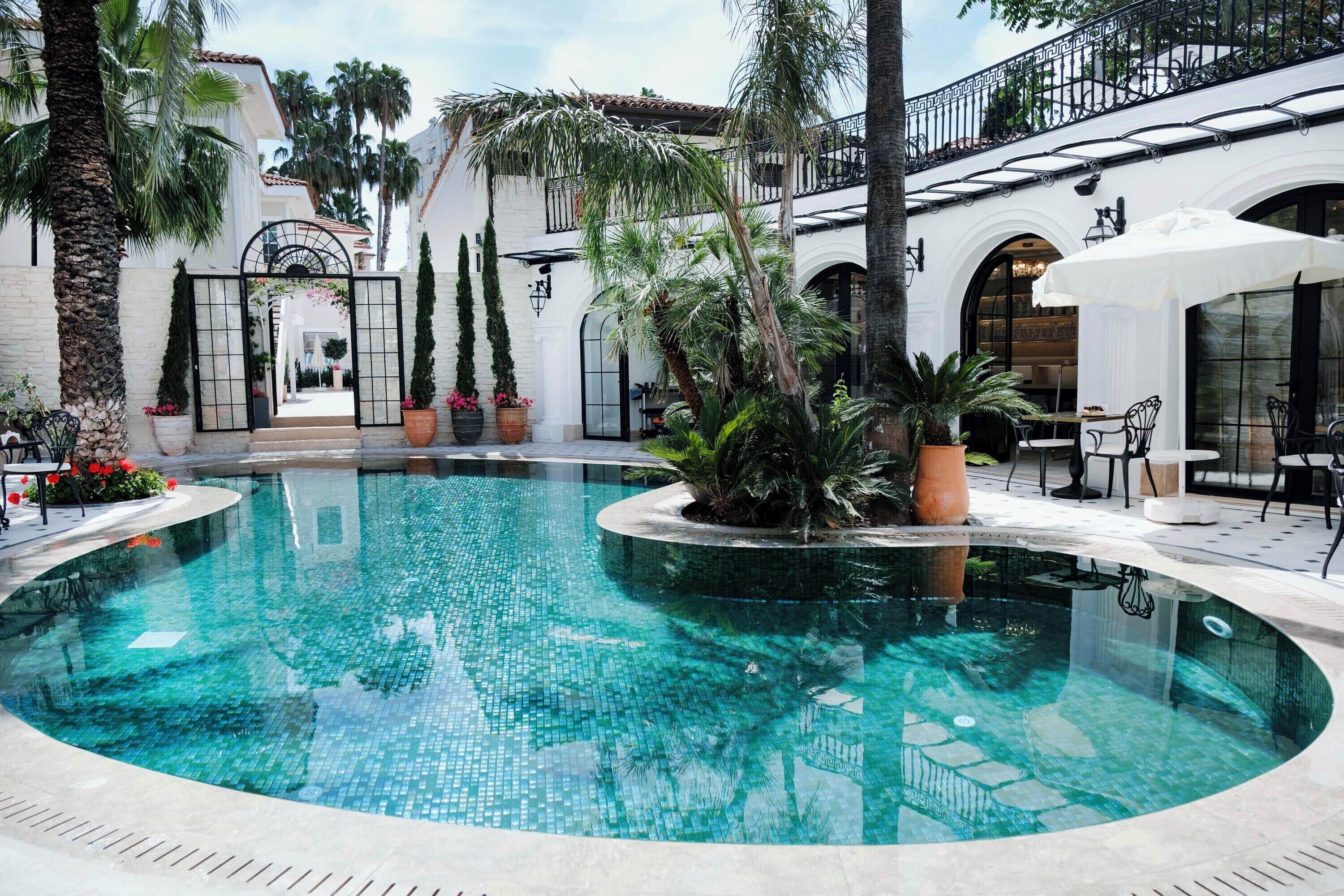 Seasonal outdoor pool, pool umbrellas, pool loungers