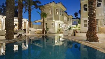 Seasonal outdoor pool, pool umbrellas, pool loungers