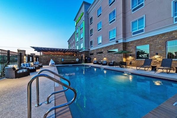 Outdoor pool, open 8 AM to 10 PM, pool loungers