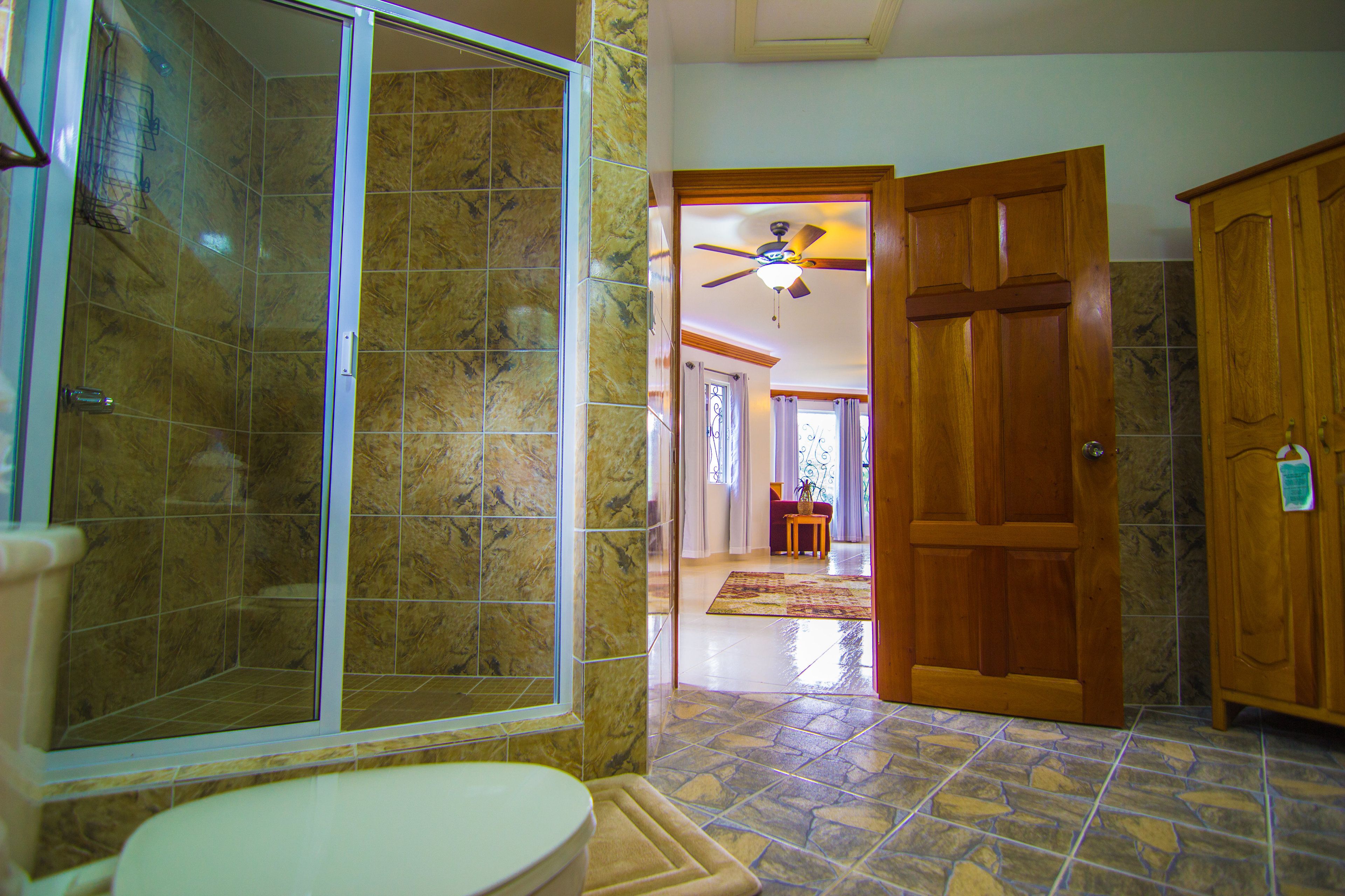 family suite | bathroom | shower, eco-friendly toiletries, towels, soap