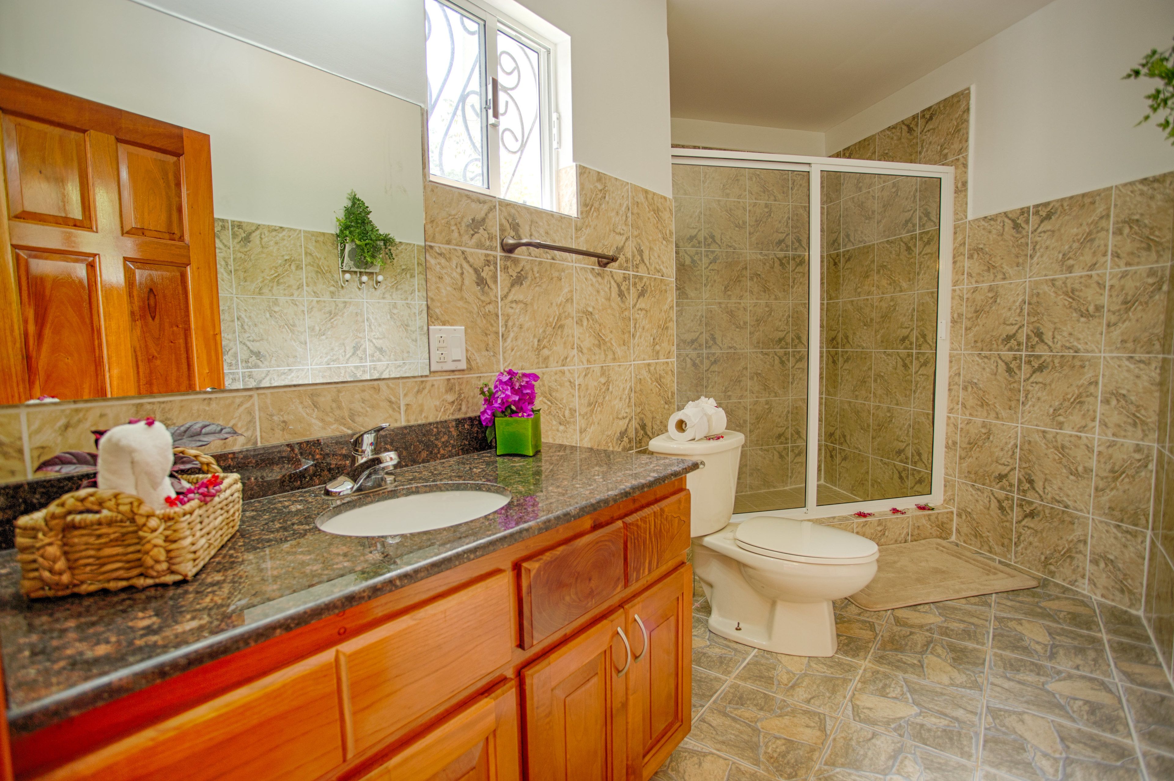 standard suite, 2 queen beds | bathroom | shower, eco-friendly toiletries, towels, soap