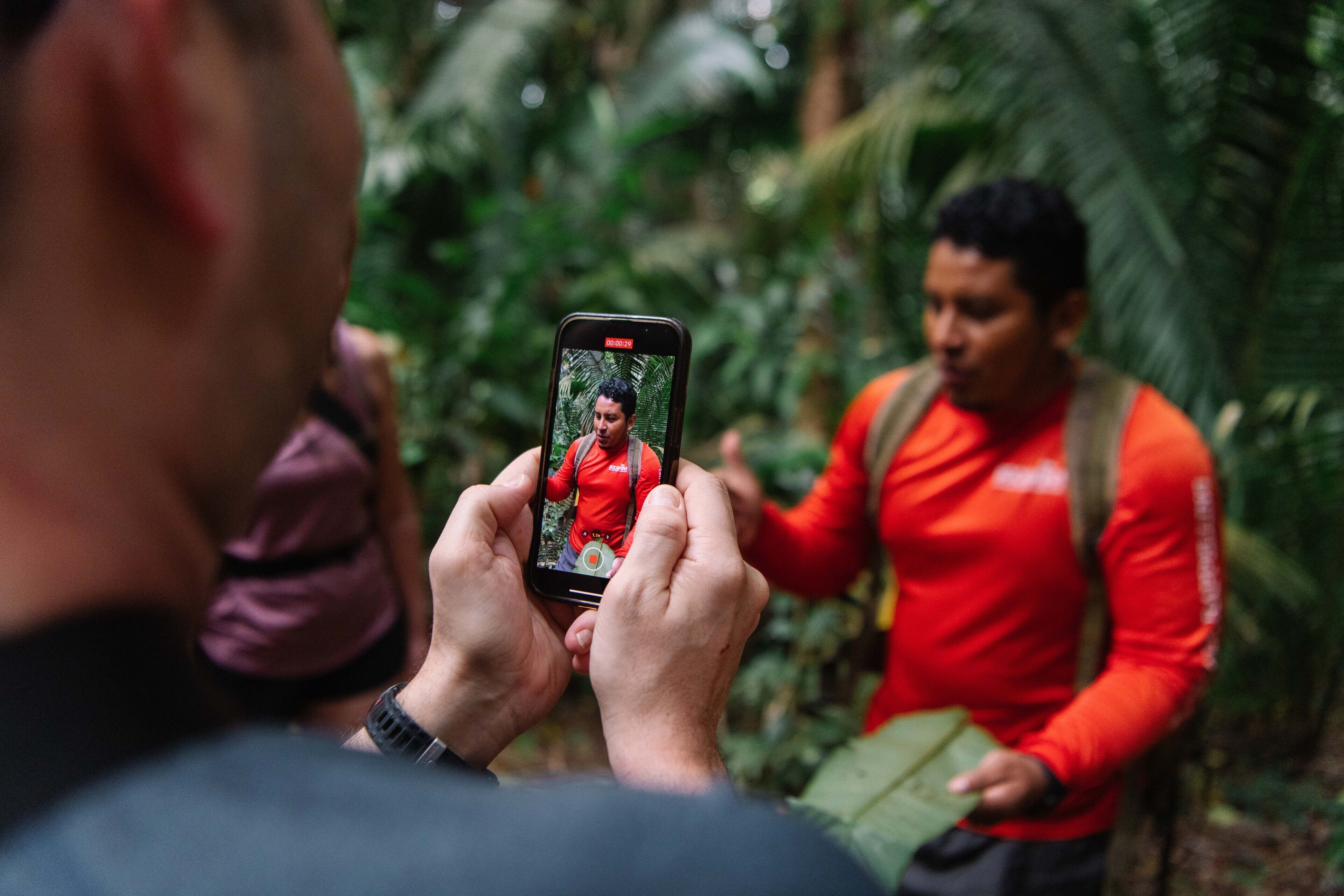 A person taking a photo with a smartphone.