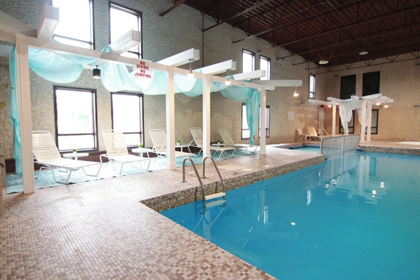 Indoor pool, open 9:00 AM to 10:00 PM, pool umbrellas, sun loungers
