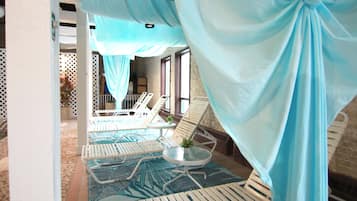 Indoor pool, open 9:00 AM to 10:00 PM, pool umbrellas, pool loungers