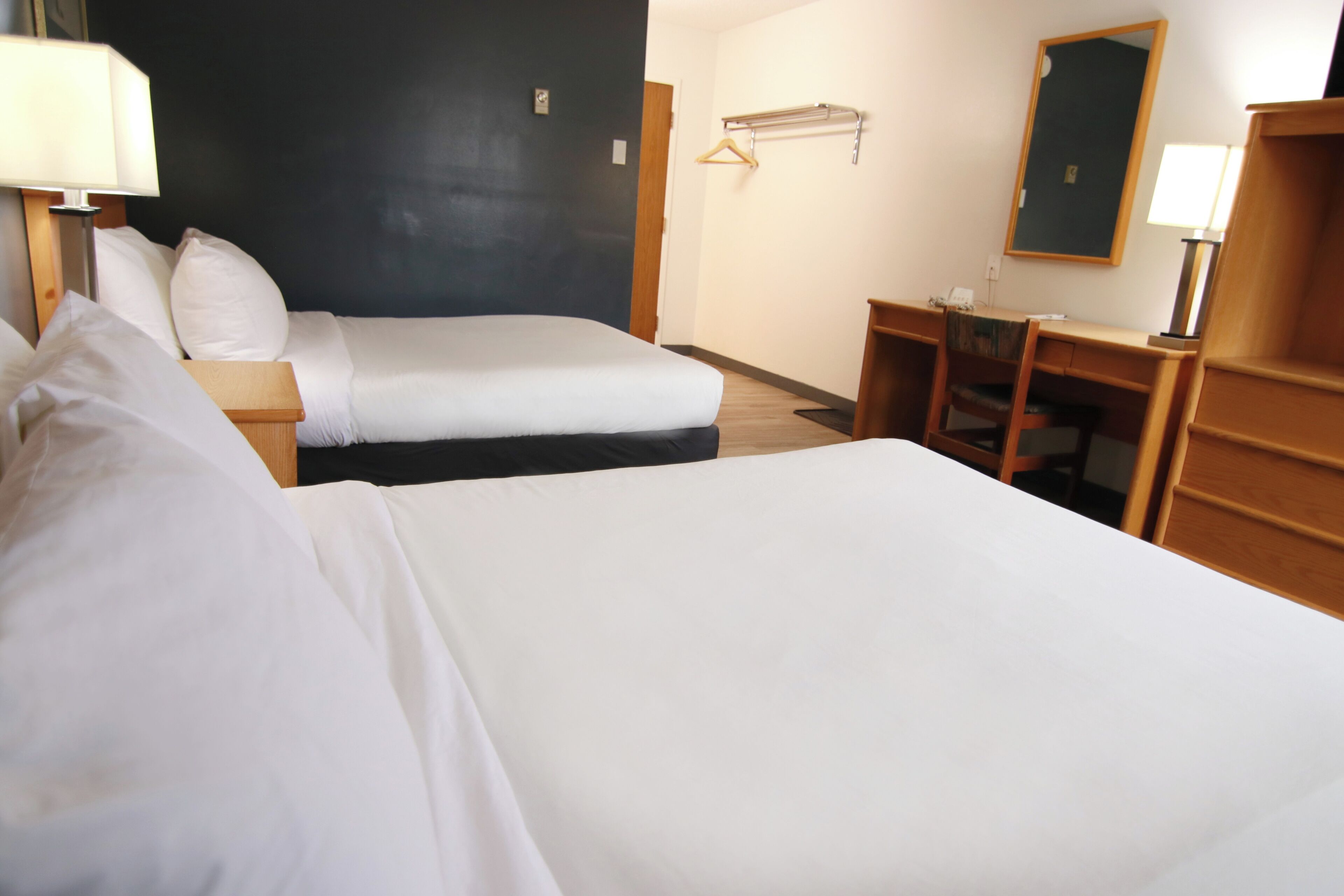 Standard Room - Outside Door | Desk, laptop workspace, iron/ironing board, cribs/infant beds