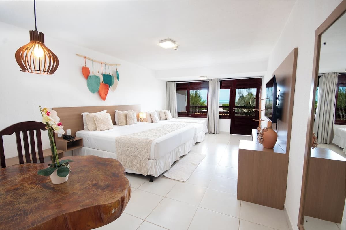 premium quadruple room, beach view | 1 bedroom, minibar, in-room safe, blackout curtains