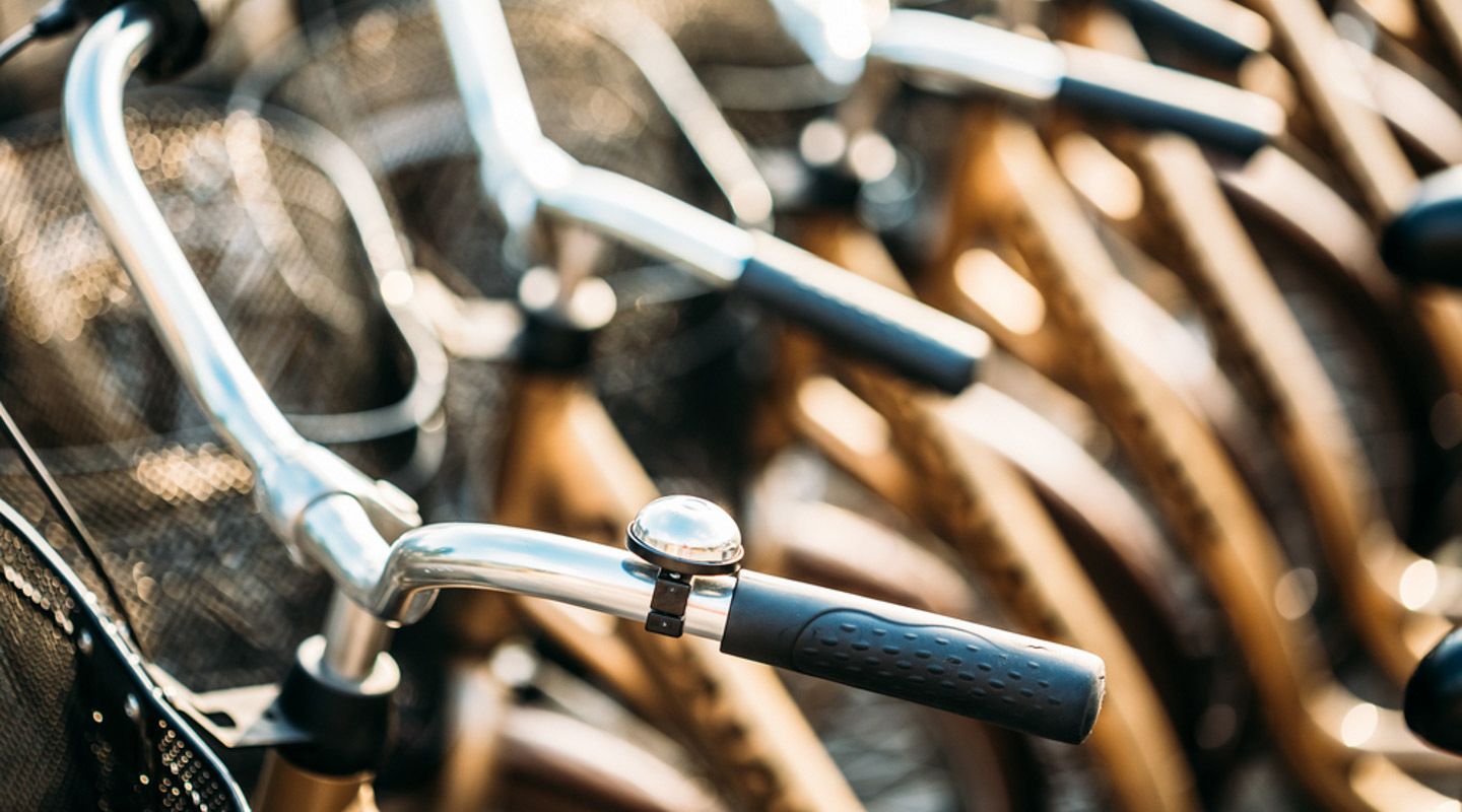 A close-up of bicycle handlebars.