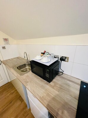 Standard Triple Room, Private Bathroom | Shared kitchen