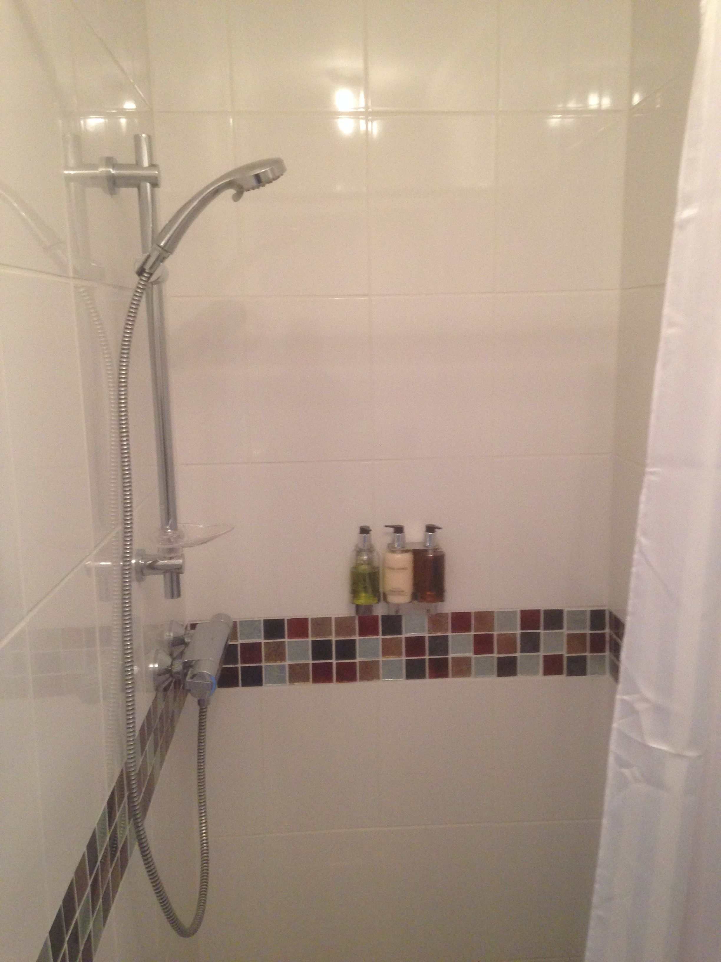 Shower, hydromassage showerhead, designer toiletries, hair dryer