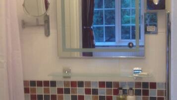 Shower, hydromassage showerhead, designer toiletries, hair dryer