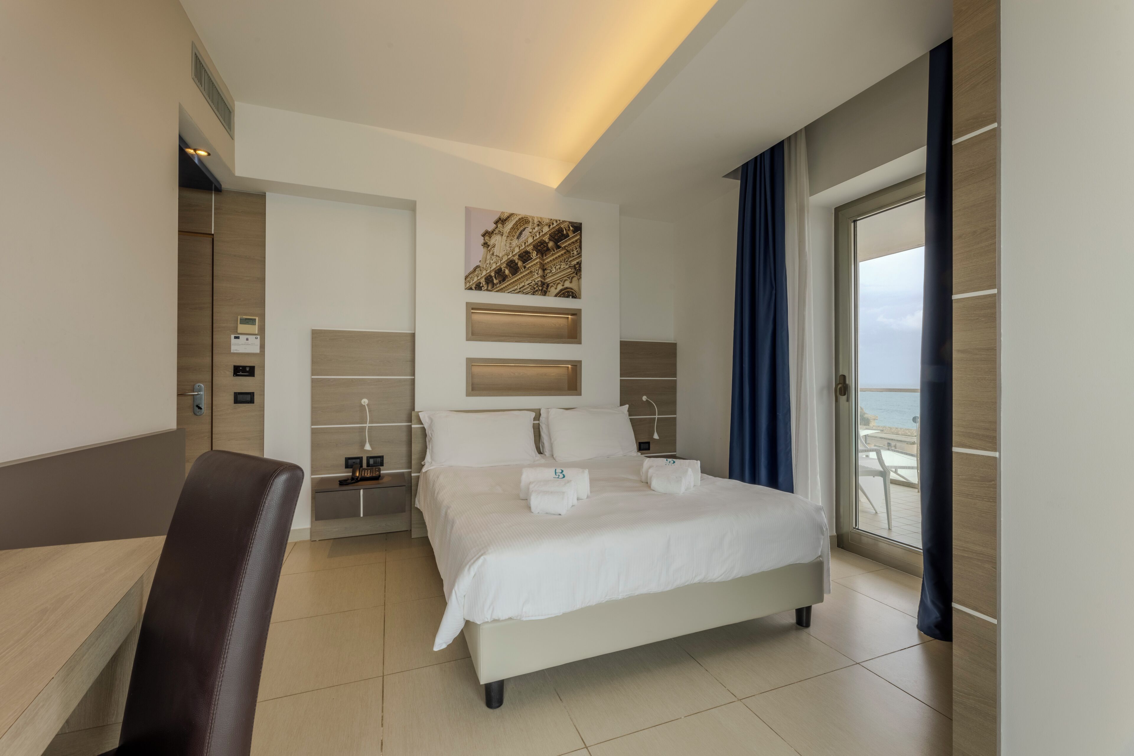 deluxe double room, sea view | premium bedding, minibar, in-room safe, desk