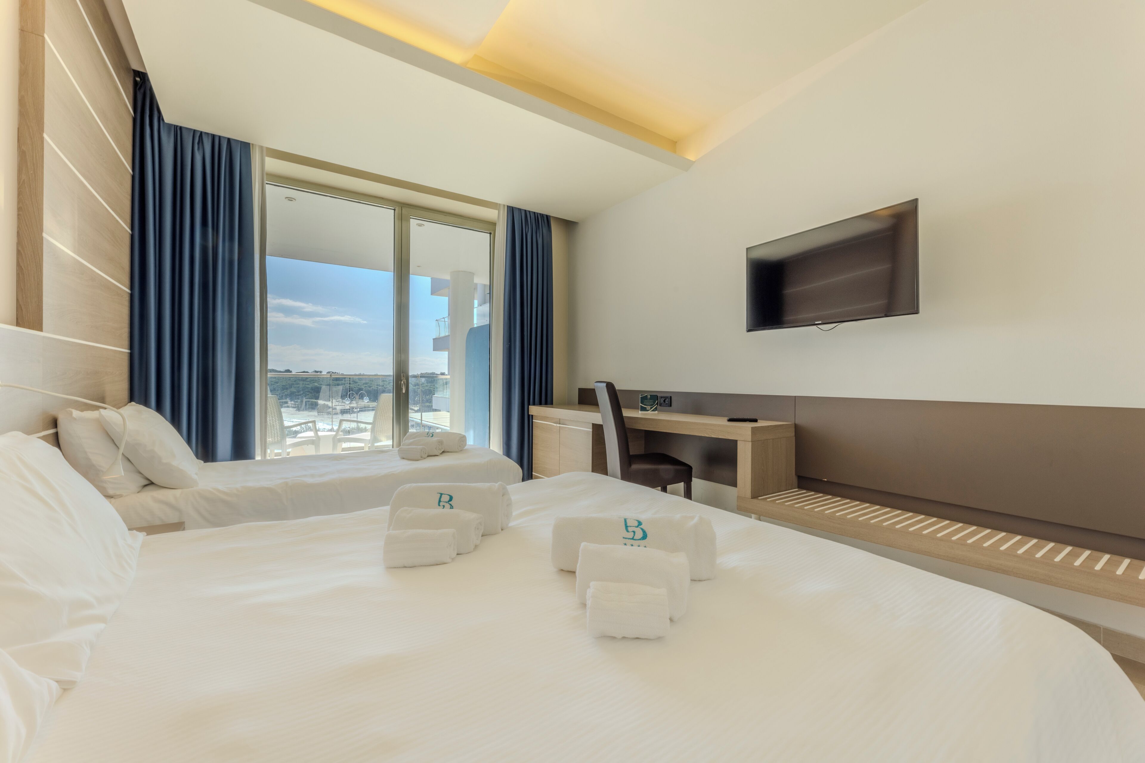 deluxe triple room | premium bedding, minibar, in-room safe, desk