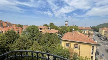 A residential area with buildings, a tower, and a street.