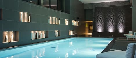 Indoor pool, open 10:00 AM to 9:00 PM, pool loungers