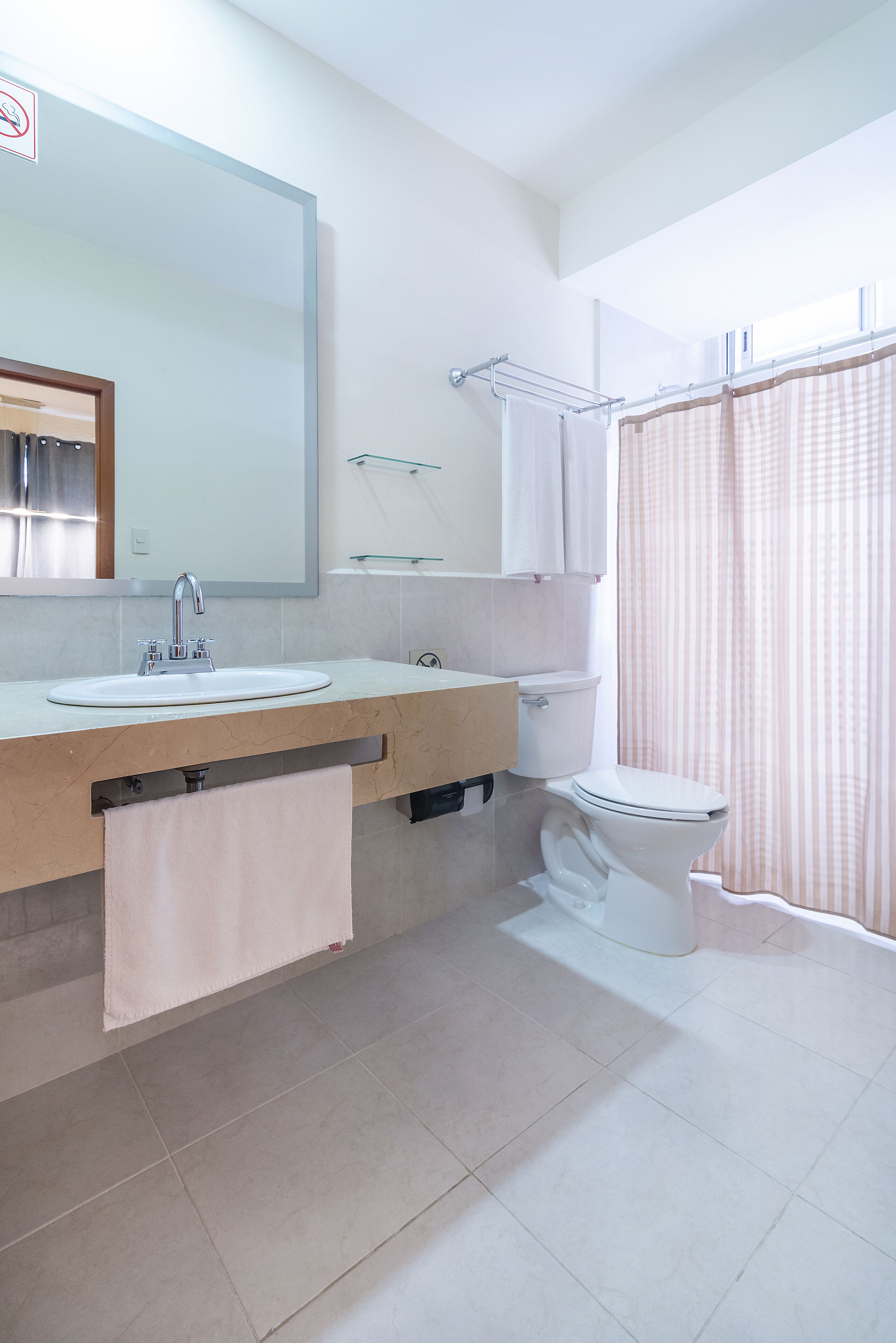 junior suite | bathroom | shower, rainfall showerhead, hair dryer, towels