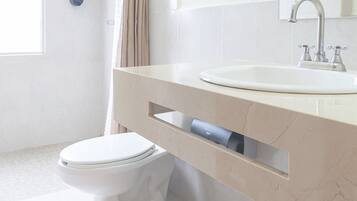 Shower, rainfall showerhead, hair dryer, towels