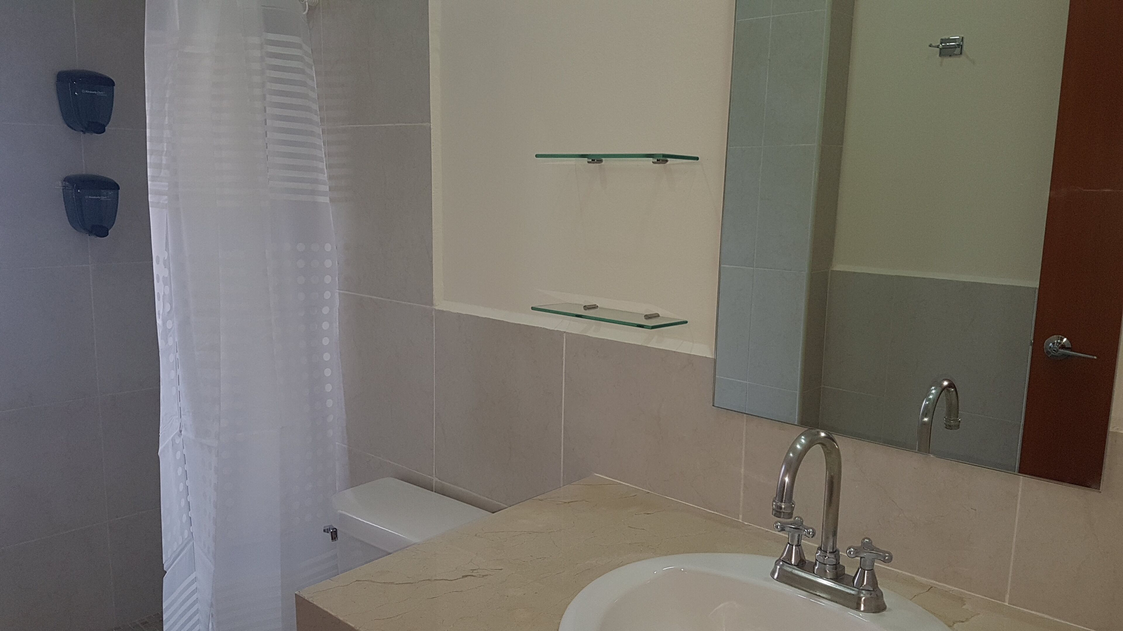 standard room | bathroom | shower, rainfall showerhead, hair dryer, towels