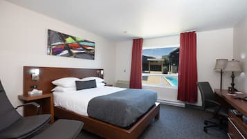 Chambre classique, 1 grand lit | Coffre-fort, bureau, rideaux d’obscurcissement, système d’insonorisation