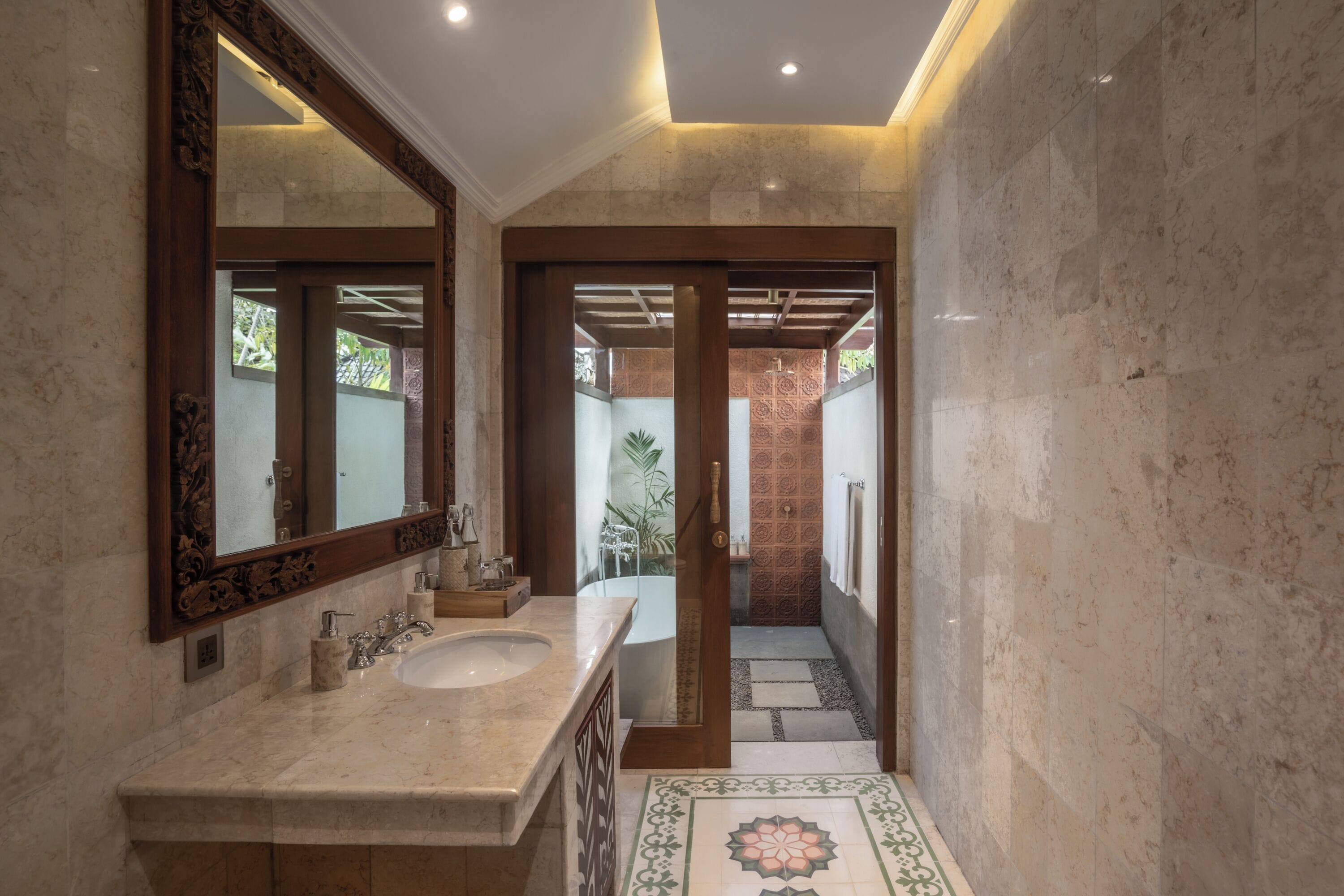 saraswati royal | bathroom | rainfall showerhead, free toiletries, hair dryer, slippers