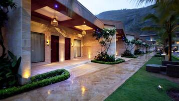 Enter a serene oasis with a beautifully landscaped garden and a striking entrance.