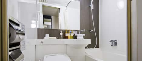 Un baño moderno con inodoro, lavabo y bañera.