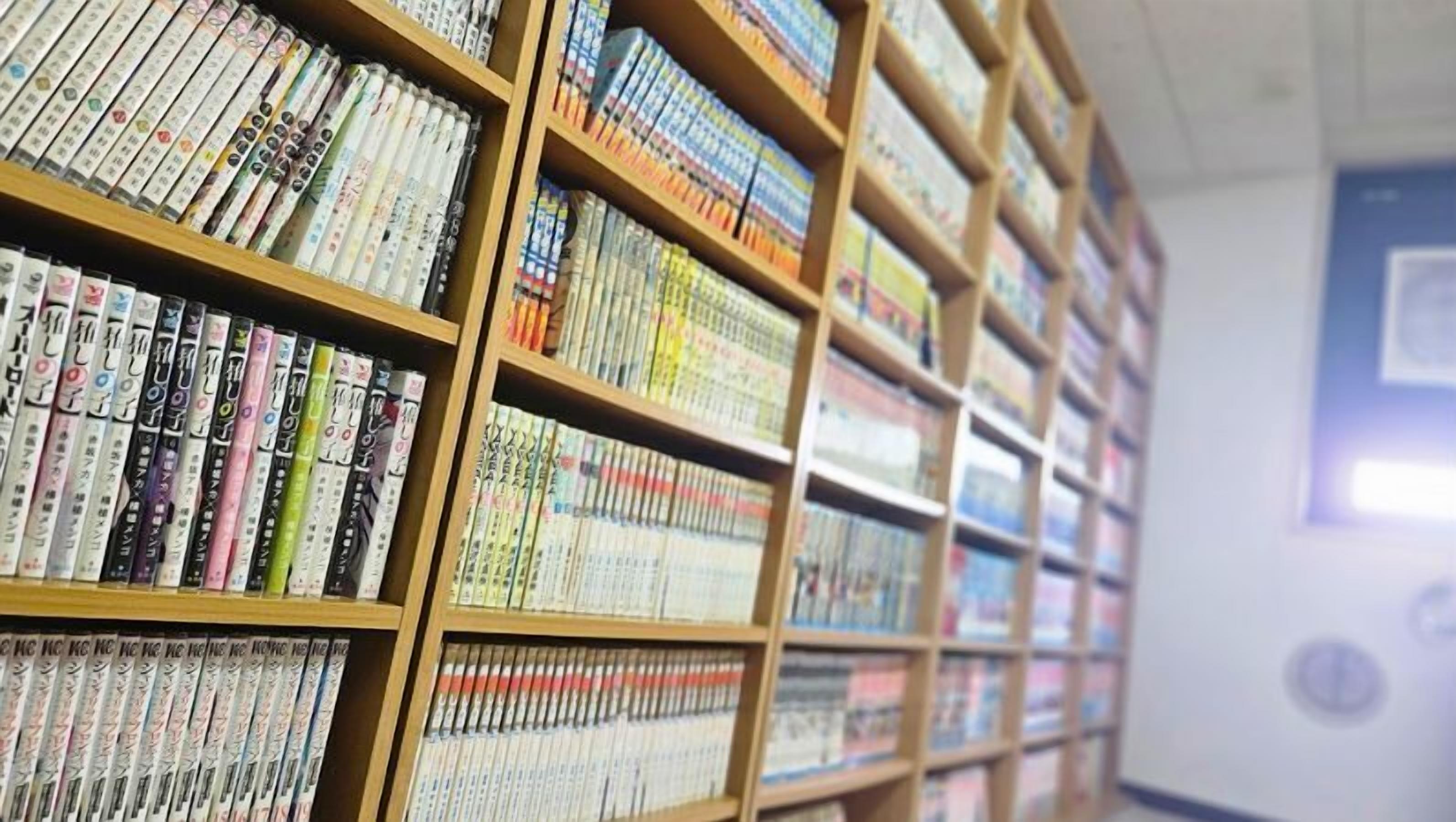 A library with bookshelves filled with books.