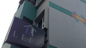 LEEZ offers a modern architectural design with a distinctive sign.