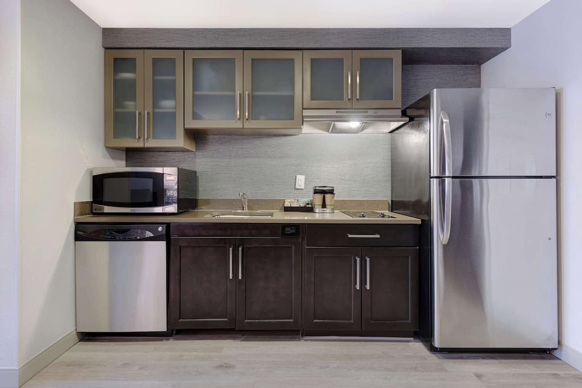 full-sized fridge, microwave, stovetop, dishwasher