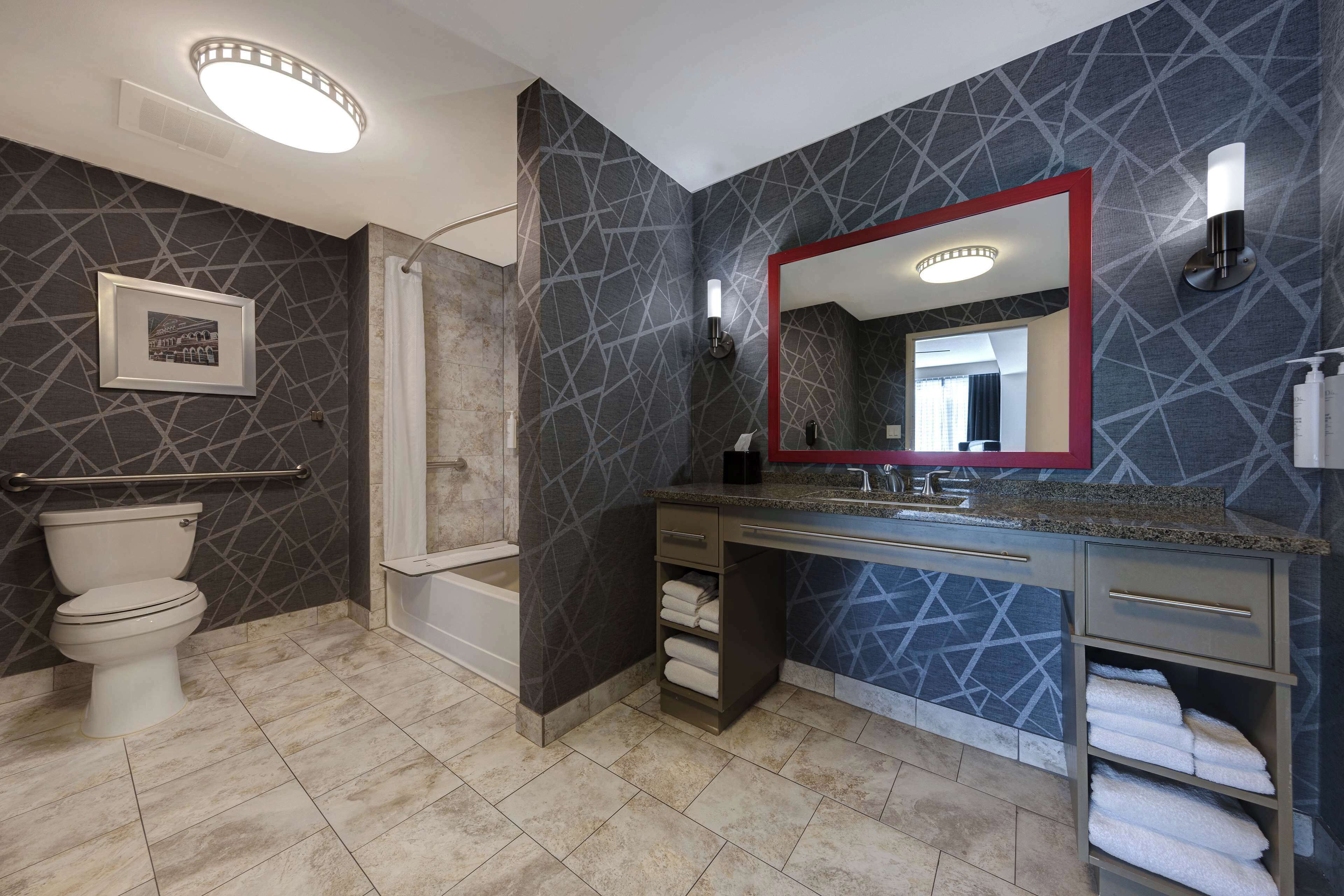 designer toiletries, hair dryer, towels, soap