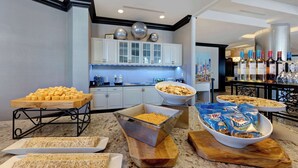A buffet setup with various food items and beverages. - Homewood Suites by Hilton Nashville Vanderbilt, TN (Nashville)
