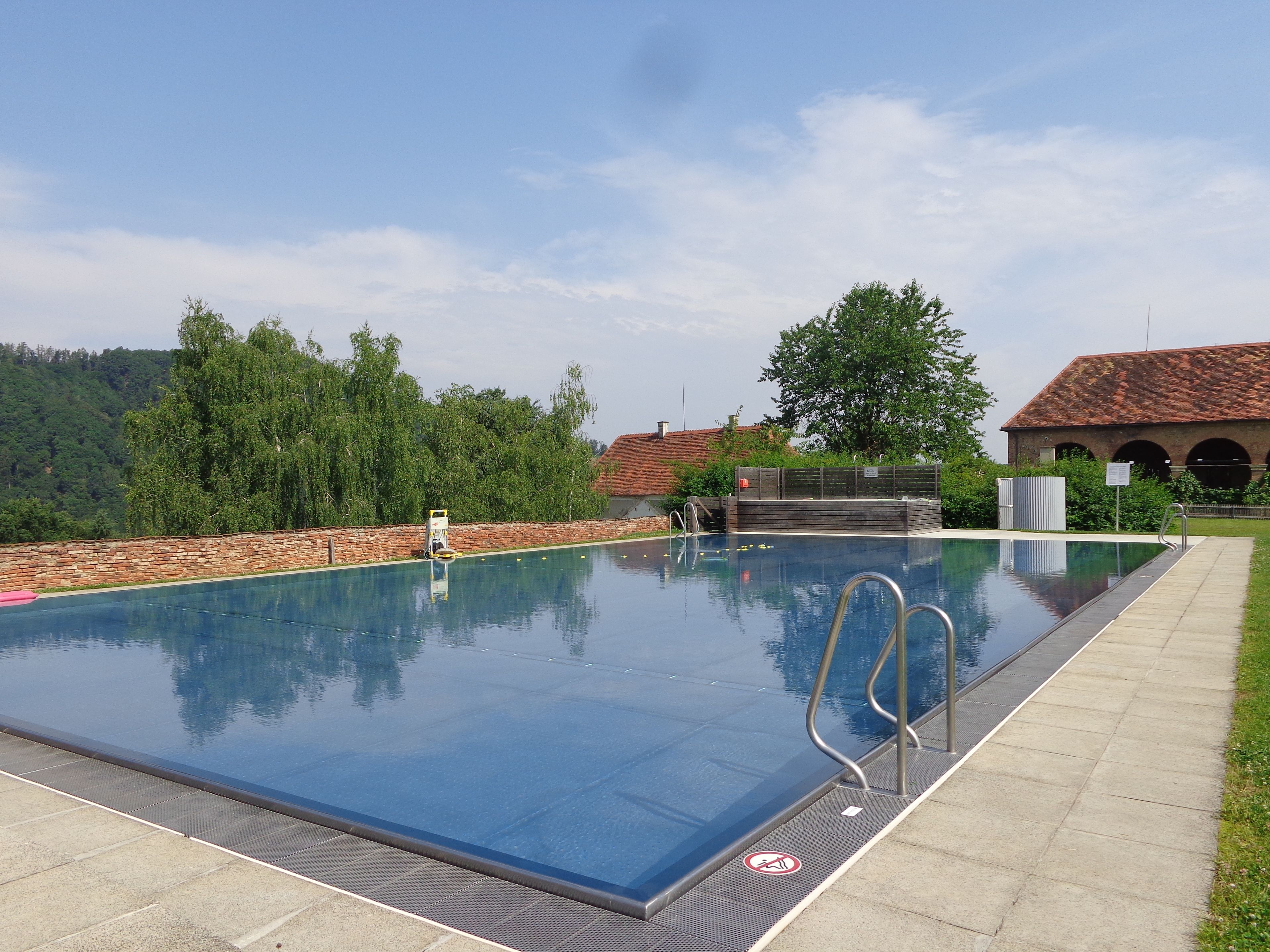 seasonal outdoor pool, pool umbrellas, pool loungers