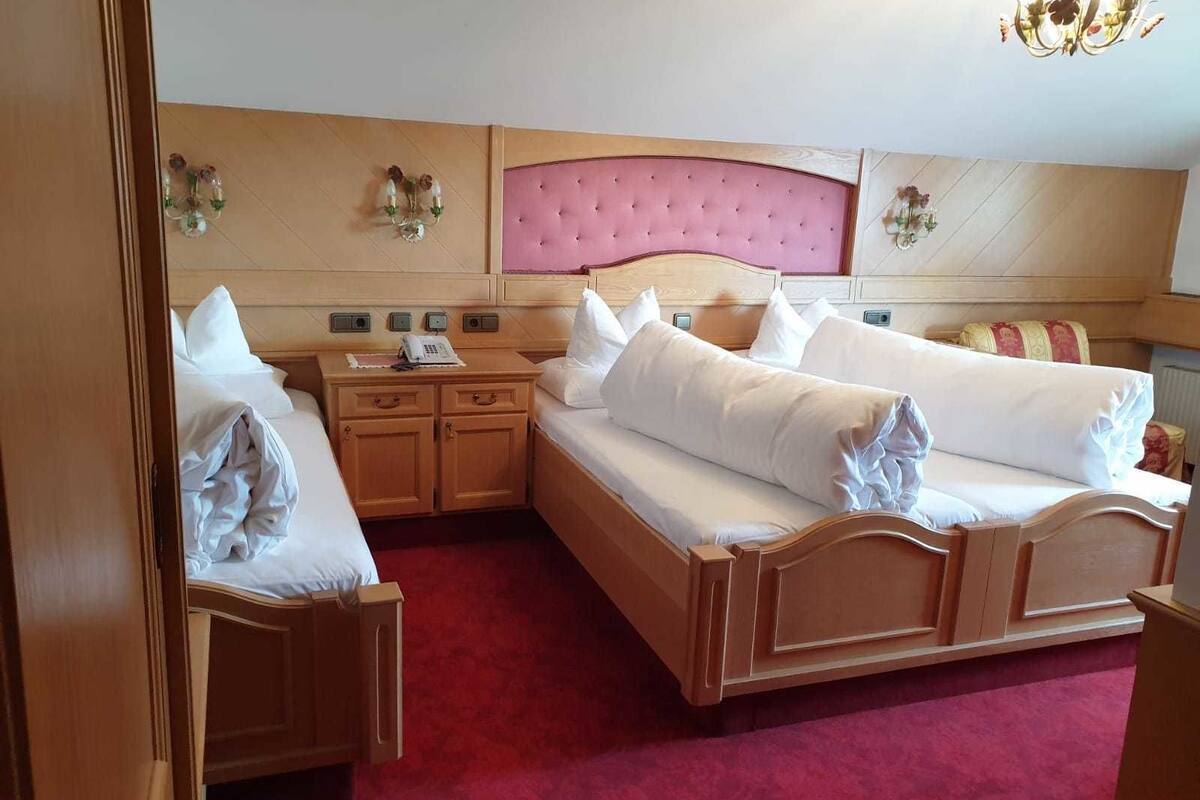 triple room, private bathroom (balcony) | in-room safe, desk, cots/infant beds, rollaway beds