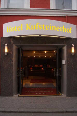 The entrance to Hotel Kufsteinerhof with a reception area visible inside. - Hotel Kufsteinerhof (Kufstein)