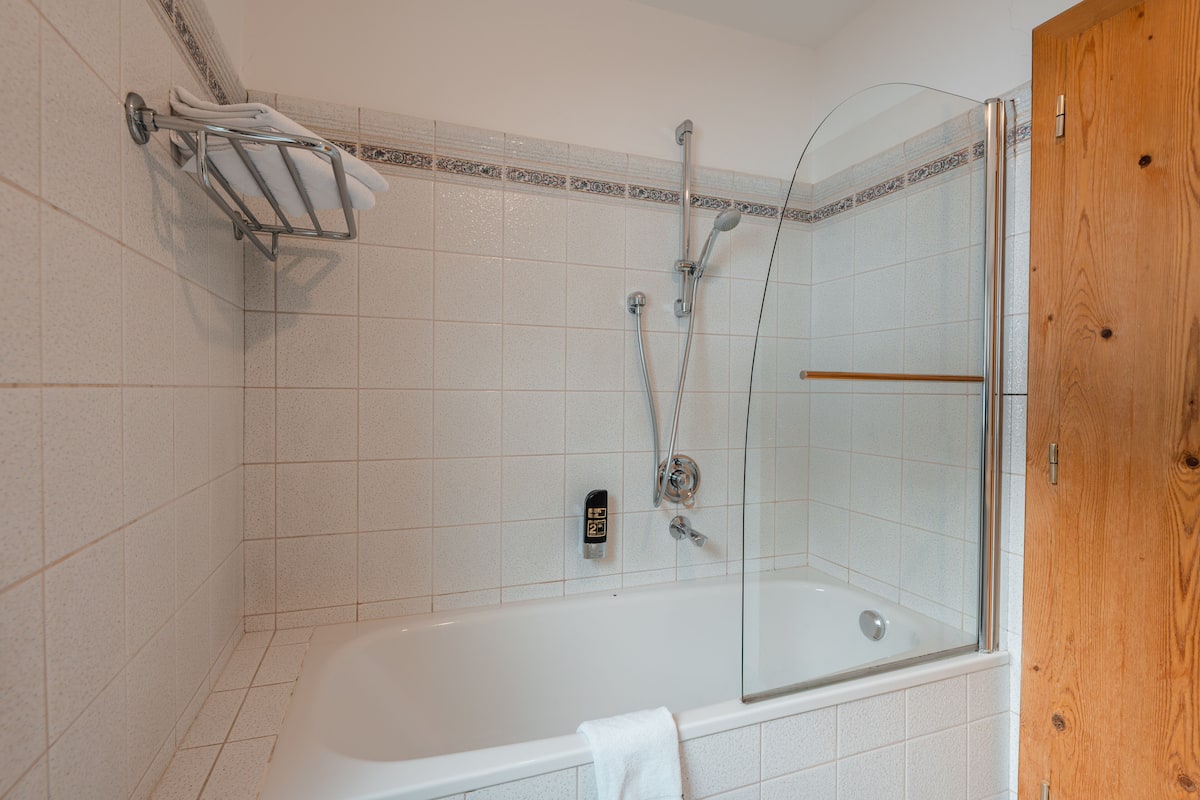 family apartment, 1 bedroom, balcony, mountain view (sonnenstein) | bathroom | combined shower/bathtub, hair dryer, bathrobes, slippers