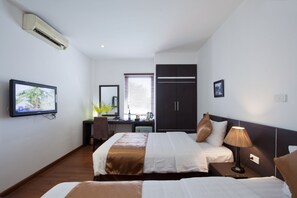 Chambre Familiale | Minibar, coffres-forts dans les chambres, rideaux occultants