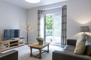 2 Bedroom Deluxe Apartments at Hedgefield location, Culduthel Road | Living room | 42-inch flat-screen TV with cable channels, TV, DVD player - Inverness City Suites (Inverness)