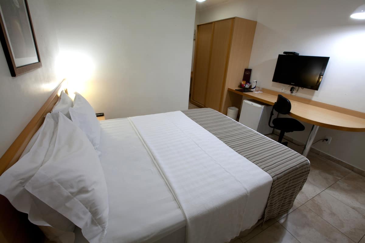 Habitación doble ejecutiva | Ropa de cama de alta calidad y artículos del minibar gratis