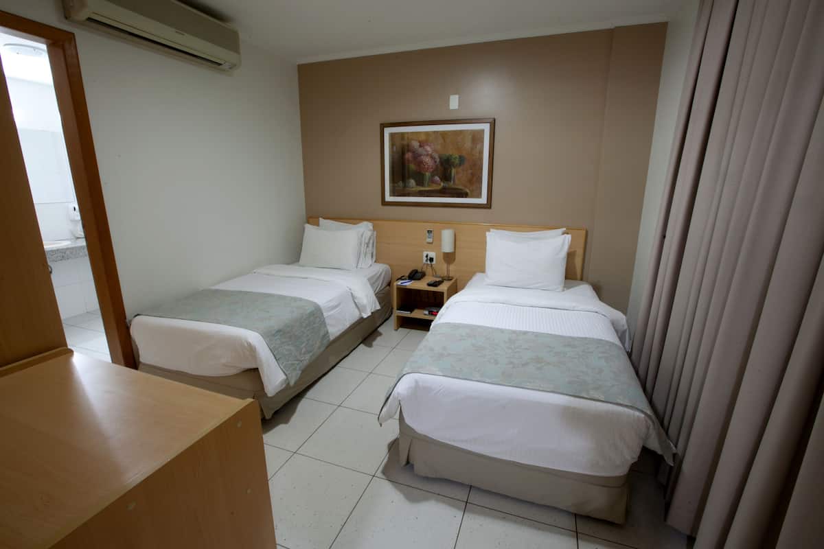 Suite ejecutiva, 1 cama matrimonial | Ropa de cama de alta calidad y artículos del minibar gratis
