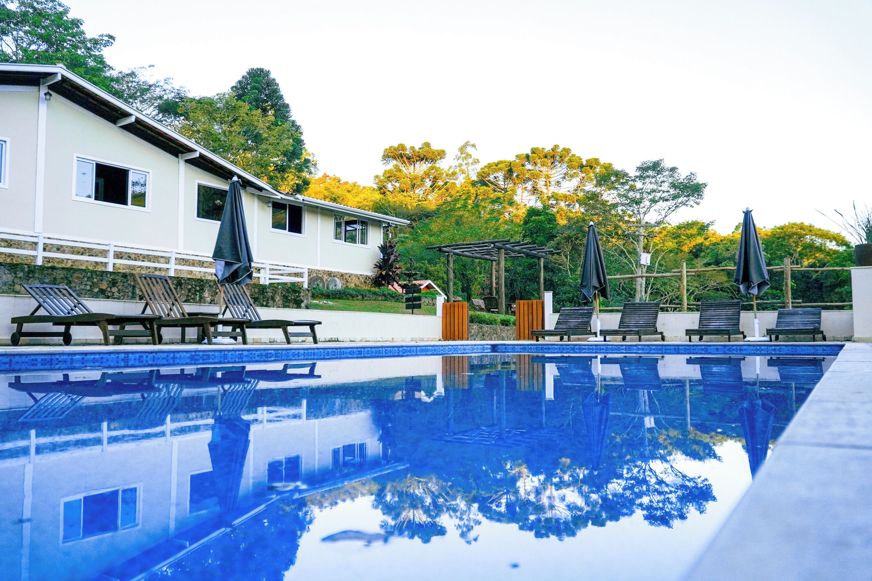 Indoor pool, outdoor pool, open 4:00 PM to 8:00 PM, pool umbrellas