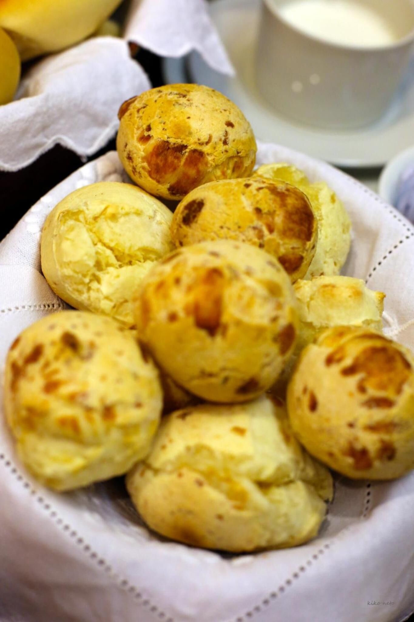 A basket of freshly baked bread rolls.