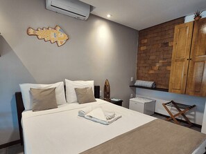 Deluxe Room, Partial Ocean View | Minibar, in-room safe, individually decorated, blackout drapes