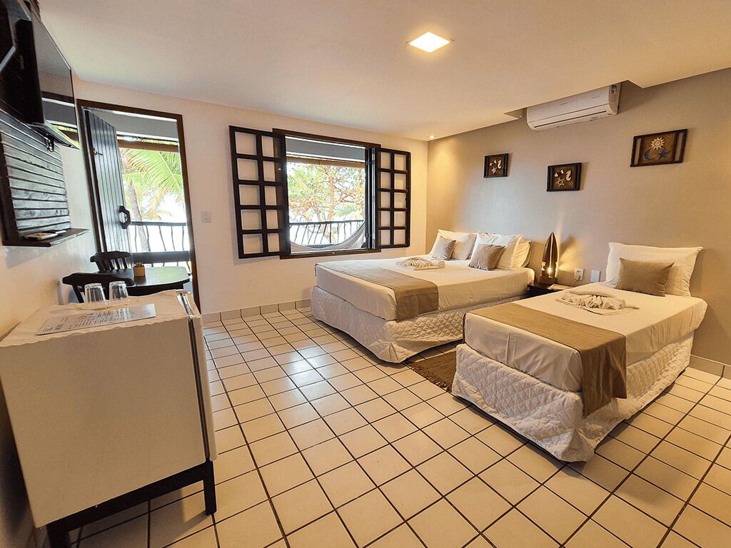 Apartamento, Vista para o mar | Frigobar, cofres nos quartos, individualmente decorados